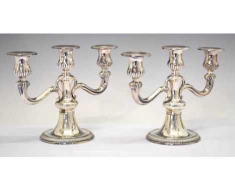 Pair of German late 20th Century 800 standard three-branch candelabra, stamped mark of Arthur Möhrle, 19cm high, filledCondit