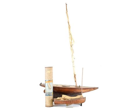 A vintage model pond yacht, with laminated hull and weighted keel, 91cm long, with rigging to reassemble, on stand, together 