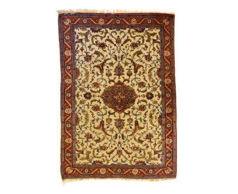 Persian part silk rug, probably Isfahan, the cream field with central medallion and all-over palmettes, tendrils and foliage 