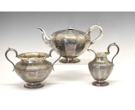 Victorian silver three-piece tea set of baluster form with engraved foliate decoration, sponsors mark of Riley &amp; Storer, 