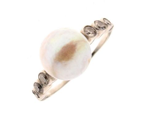 Diamond and pearl ring, the white mount unmarked, the pearl (untested and unwarranted) of approx 8.5mm diameter, with a trio 