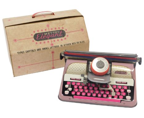 A Mettoy Elegant tinplate typewriter, in pink, 26cm wide, boxed. 