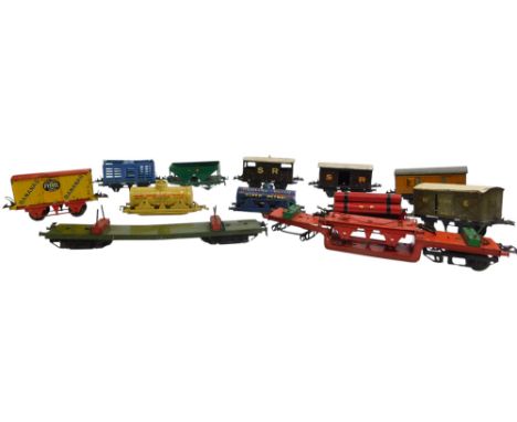 O gauge rolling stock, including RS706 flat truck with cable drum, LNER guards coach, BP Spirit tanker, Fyffes banana truck, 