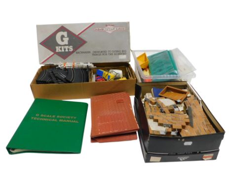 Bachmann Big Haulers G gauge track, together with scenery, Cadbury's Mini Fingers novelty tin, Hornby OO gauge tinplate carri