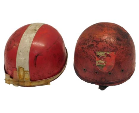 Two Pudding Basin helmets, one with a Castrol sticker. (AF)