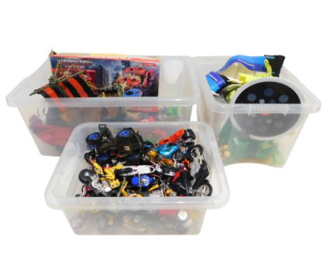 Various toys and football equipment, including quadbikes, motorcycles, Action Man style dolls, goal keeper gloves, Manchester