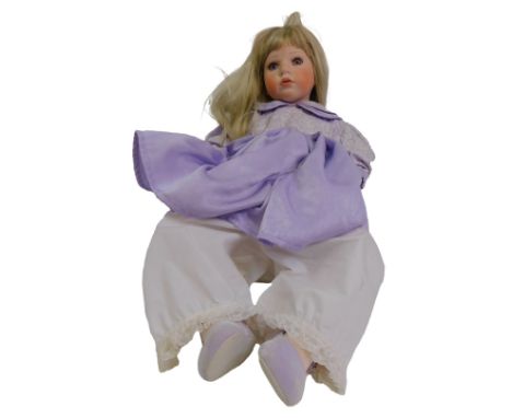 A Celia limited edition porcelain doll, in purple dress, 60cm.