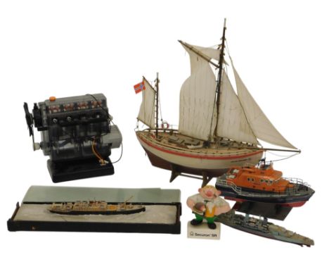 A scale model of a 19thC passenger ship, World War II battleship, a lifeboat, a wooden Norwegian sailing ship Colin Archer, a