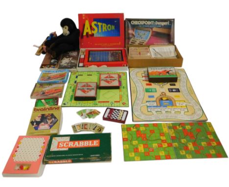 Various board games, to include Monopoly, Totopoly, Mastermind, Travelling Chess, Pelham Puppet, monkey pyjama case, etc. (2 
