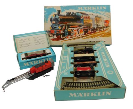 A Marklin HO gauge 3001 locomotive 6302 of the Deutsche Bahn Railway, a Marklin 3200 DB Goods train set with locomotive, box 