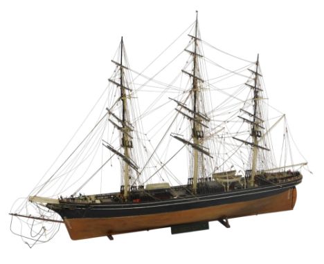A scale model of The Cutty Sark, fully rigged, without sails, on a wooden base, with title plate, 80cm wide. 