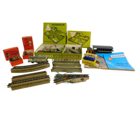 Marklin HO gauge track and accessories, including a mechanically operated level crossing, 5106 straight track sections, 5120 