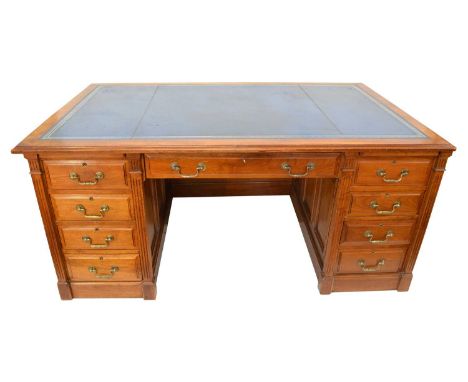 Mid-20th Century Walnut Twin Pedestal Desk Rectangular top with blue leather inset supported on two pedestals, each fitted wi