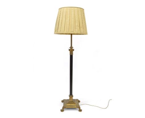 Early 20th century Brass Corinthian Column Standard Lamp Cast capitals with an ebonised fluted column, on a stepped square ba
