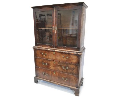 Mid 18th Century Walnut Cabinet on Chest The upper section with a moulded cornice over a pair of glazed doors enclosing a sin