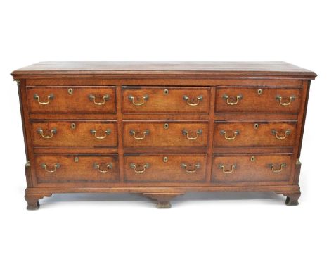 George III Oak and Mahogany Cross-Banded Cheshire or Lancashire Dresser Base Rectangular three-plank moulded top over nine sh