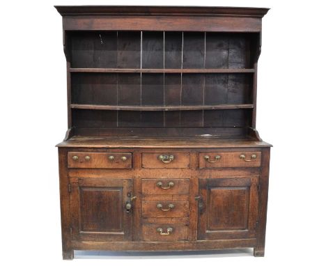 George III Welsh Oak Dresser Moulded cornice with a planked back supporting two pot shelves, the rectangular base with a two 