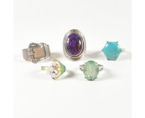 A collection of 925 silver, gem set and enamel rings. The rings to include a silver and gradient-coloured enamel cross over r