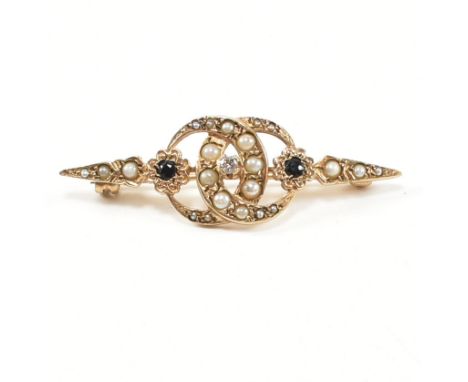 A hallmarked 9ct gold, sapphire, diamond and seed pearl brooch pin. The brooch pin having a central round cut diamond flanked