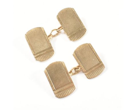 A pair of hallmarked 9ct gold cufflinks. The 9ct gold cufflinks having faces with engine turned design, linked by chain. Hall