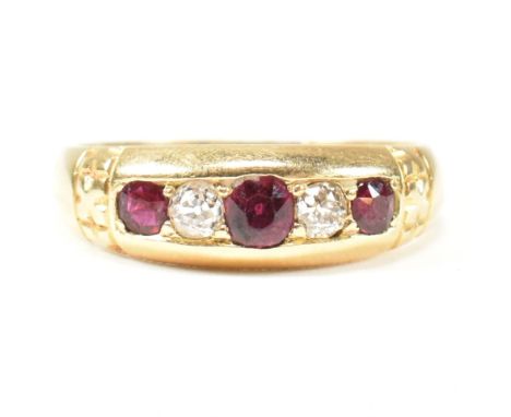 A Victorian 18ct gold ruby and diamond five stone ring. The ring set with three round cut rubies and two old cut diamonds. Pa