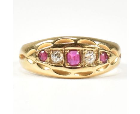 A Victorian hallmarked 18ct gold ruby and diamond gypsy ring. The ring set with three rubies and two old cut diamonds. Hallma