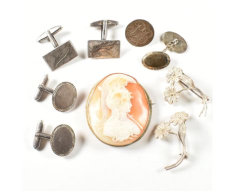 A collection of silver jewellery including a cameo brooch pin. The jewellery to include a hallmarked silver golf marker, hall