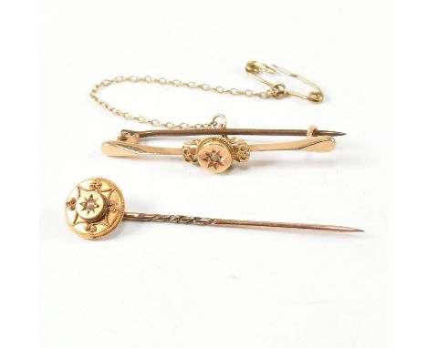 A 19th century 15ct gold and gem set brooch pin and stick pin. The lot to include a 15ct gold bar brooch pin set with a centr