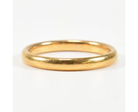 A hallmarked 22ct gold band ring. The 22ct band ring hallmarked for London, 1951. Maker's mark W.W.Ltd for W Wilkinson Ltd. S