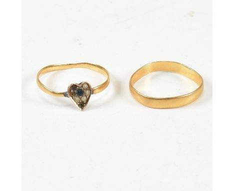 A hallmarked 22ct gold band ring and a hallmarked 14ct gold and seed pearl heart ring. The Victorian 22ct gold band ring hall