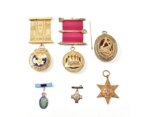 A collection of Masonic jewel medals. The medals to include A hallmarked silver medal with crown motif on burgundy silk havin