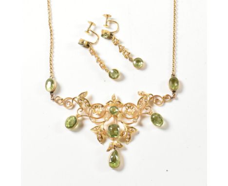 An Edwardian 9ct gold peridot and pearl necklace and earring suite. The fringe necklace having bezel set peridot and seed pea