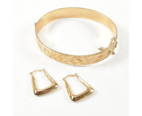A hallmarked 9ct gold hinged bangle and a pair of 9ct gold hoop earrings. The lot to include a hallmarked 9ct gold hinged ban