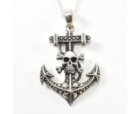 A 925 silver skull and anchor pendant necklace. The silver chain necklace strung with a silver skull and anchor pendant. Mark