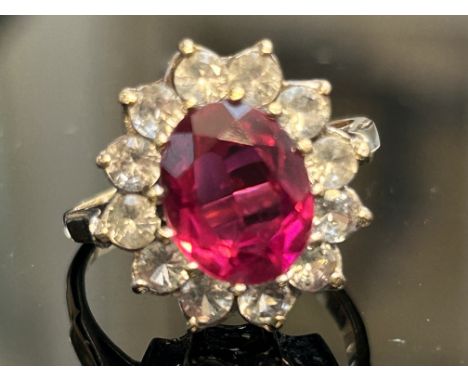 9ct Gold ring set with large pink/red stone surrounded by white stones 3.7g Size N