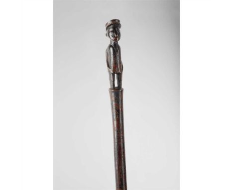 ZULU STAFF SOUTHERN AFRICA carved wood, with a finial depicting an officer in colonial dress, rich patination (Dimensions: 68