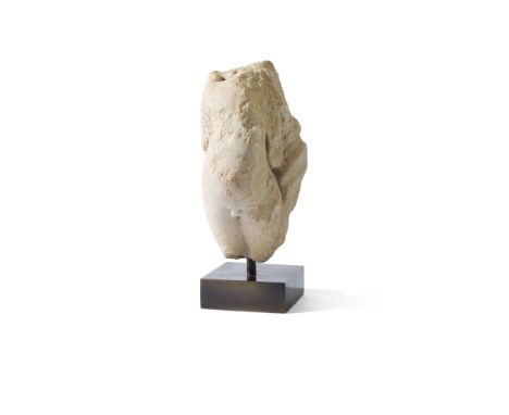 ROMAN STATUETTE OF CUPID ROMAN EMPIRE, C. 3RD CENTURY AD carved marble, the nude figure shown posed against a palmette and fo
