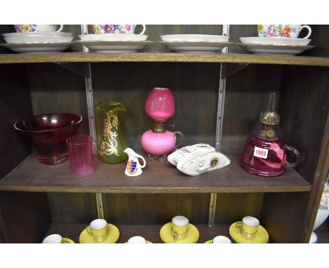 A mixed group of ceramics, to include: a small opaque pink glass oil lamp, 19cm high; and a Carltonware crested tank, 16cm lo