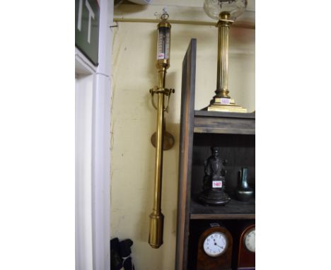 A brass marine stick barometer,&nbsp;the silvered dial inscribed 'FJBLM 16a22, R.N. Desterro, Lisbon', with gimbal wall mount