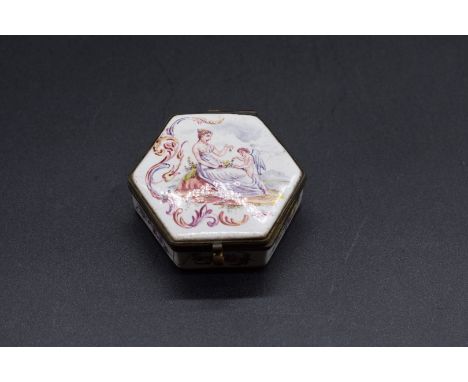 A French Lille enamel hexagonal pill box,&nbsp;dated 1767, painted to the hinged cover with a classical lady and cherub, 6cm 