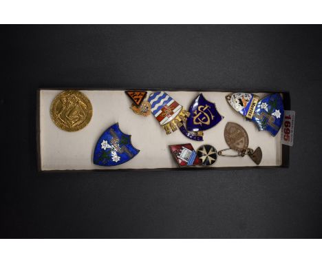 A small collection of enamel badges,&nbsp;to include a scarce 20th Century Fox example. 