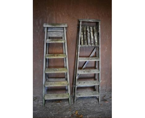 Two old wooden step ladders, largest 155cm high, smallest 145cm high. 
