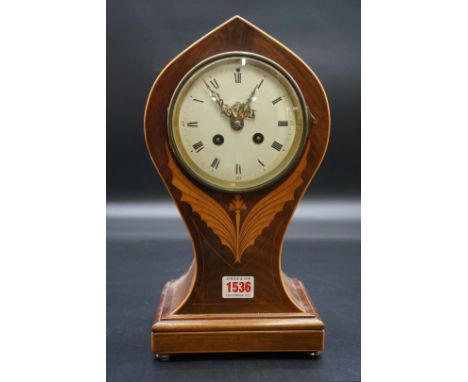 A circa 1900 mahogany and inlaid mantel clock, 33cm high, with pendulum.&nbsp; 