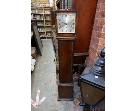 A 1920s oak small longcase clock, striking on five straight gongs, 127cm high. 