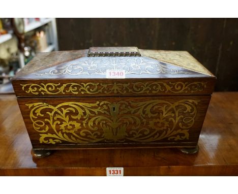 An early 19th century rosewood and brass inlaid sarcophagus tea caddy, 33cm wide, (s.d.). 