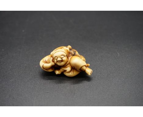 A good Japanese carved ivory netsuke, Edo, depicting a&nbsp; sleeping Saruwamashi and monkey, 5cm wide. 