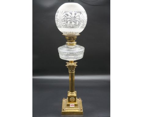 An antique brass Corinthian column oil lamp,&nbsp;height including shade 71.5cm.&nbsp; 