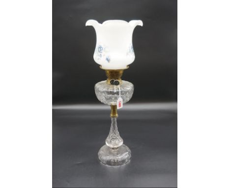 An antique cut clear glass oil lamp, height including opaque white glass shade 40cm, (soldered repair to glass base).&nbsp;&n