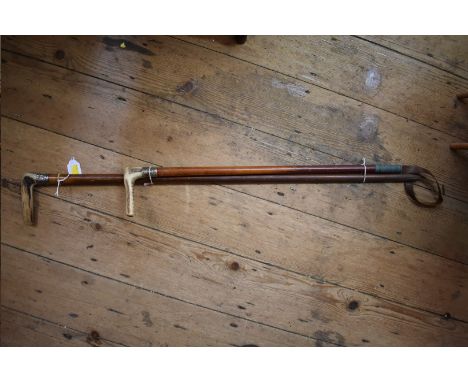 A horn handled silver mounted malacca walking stick;&nbsp;and a similar riding crop. 