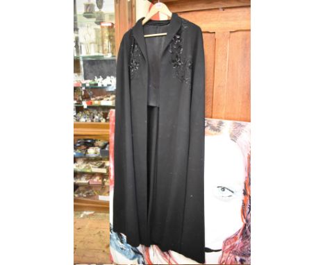 Textiles:&nbsp;a 1950s black felt cloak, with black beadwork decoration; together with four vintage evening bags.&nbsp; 